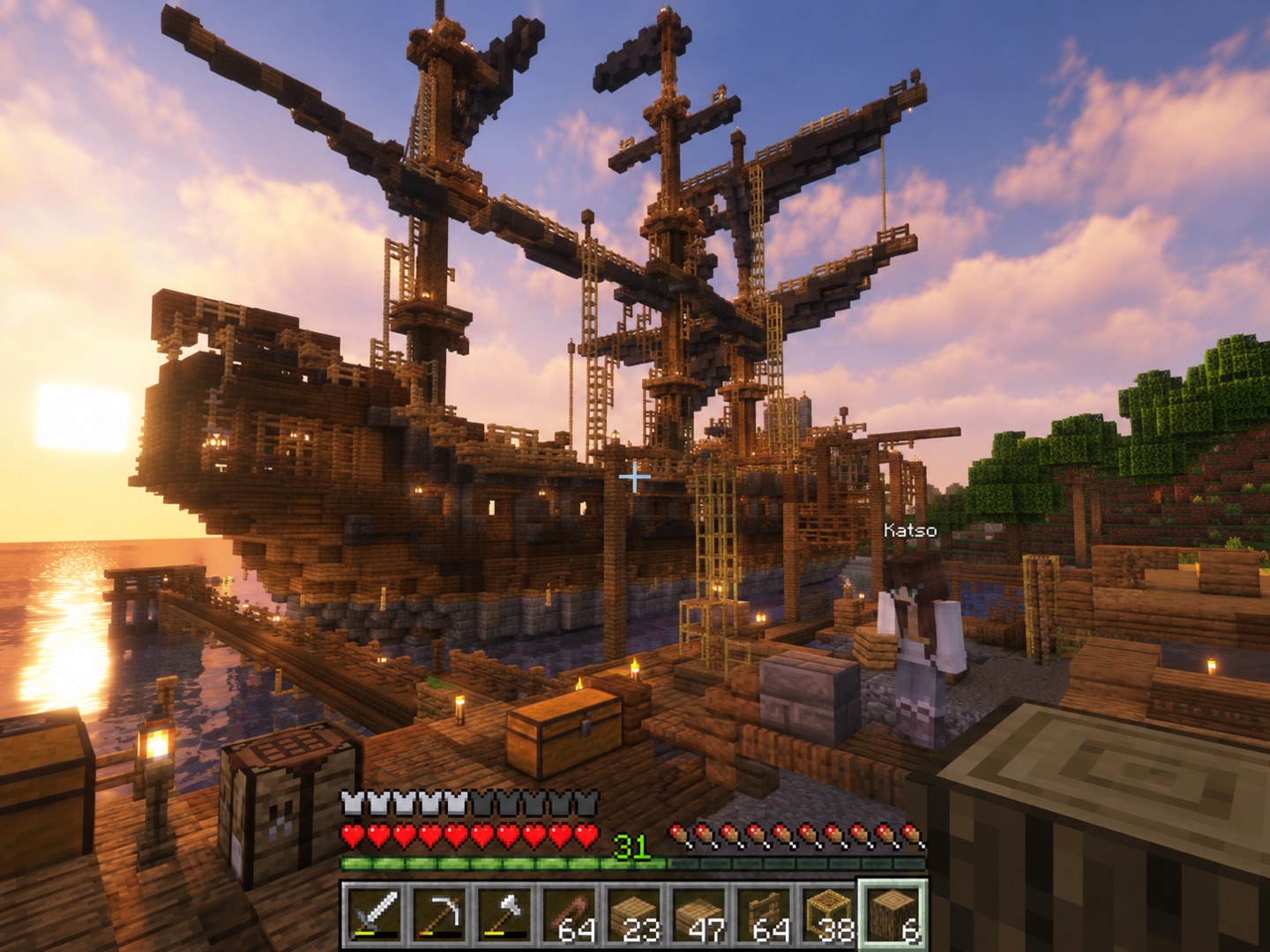 Katso beside a huge player-built pirate ship in Minecraft at sunset